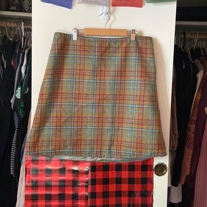 Plaid skirt, mid thigh length, high waisted.